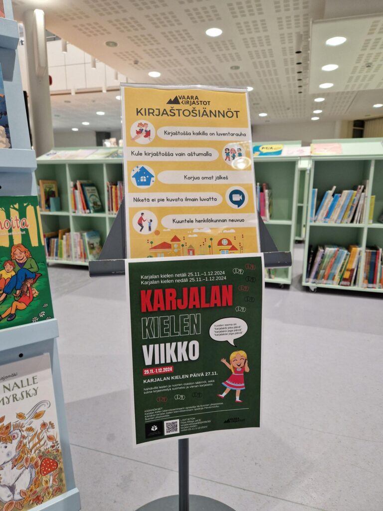 Kirjasto. Karjalankielinen opasteteksti.