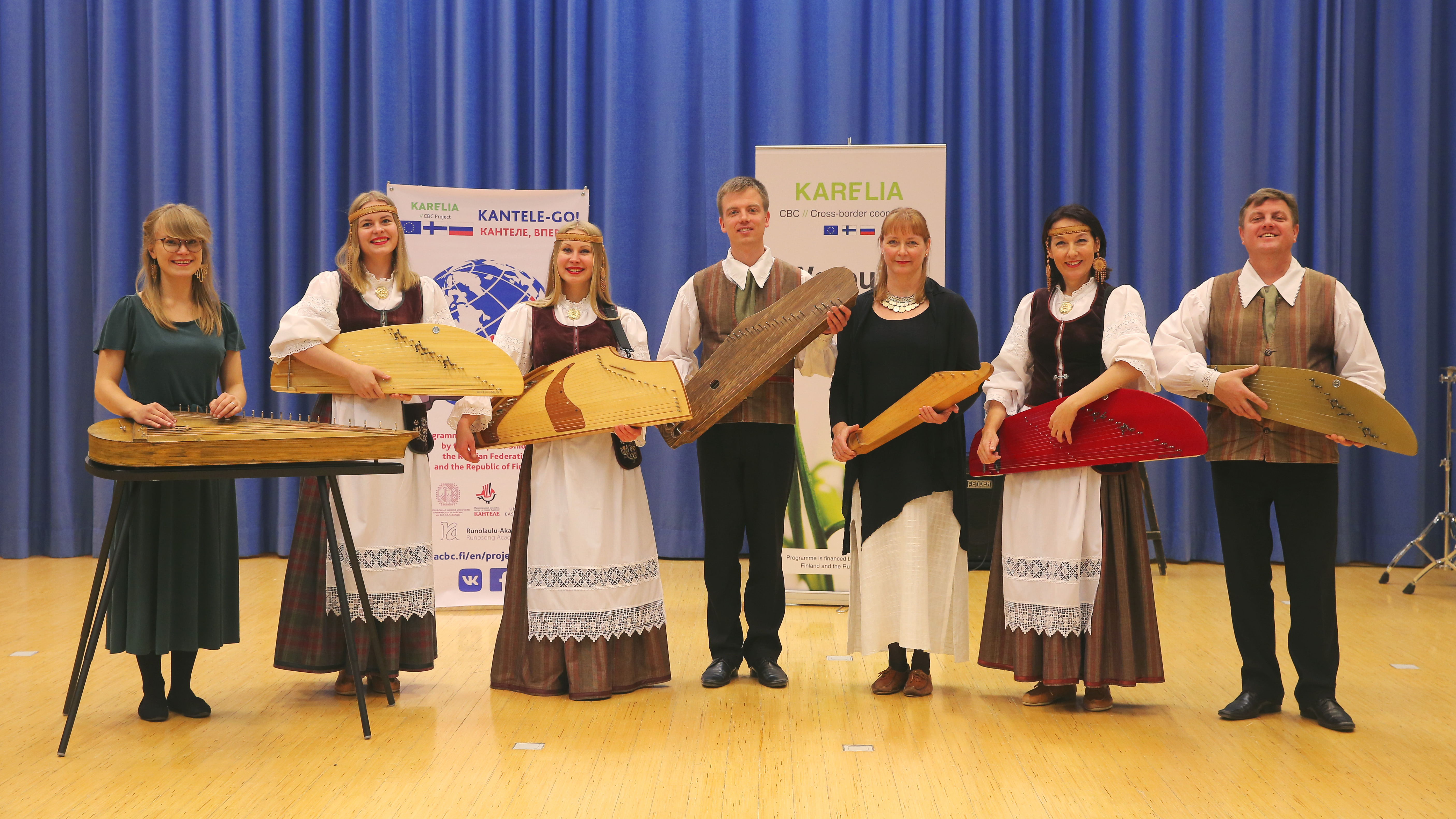 Kantele musicians in traditional folk costumes