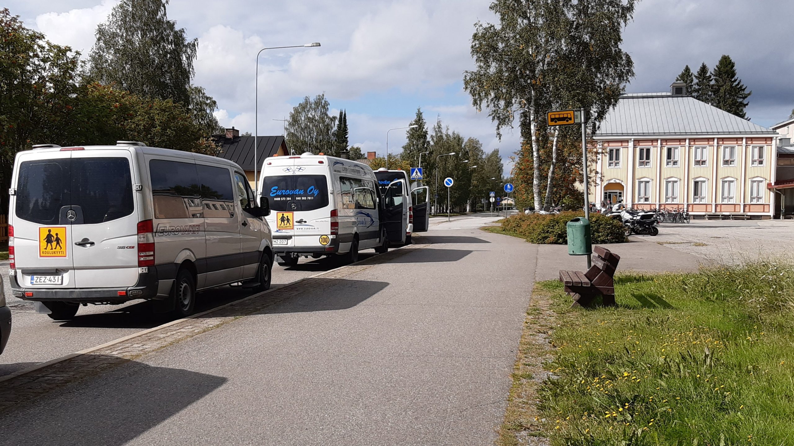 a line of school buses