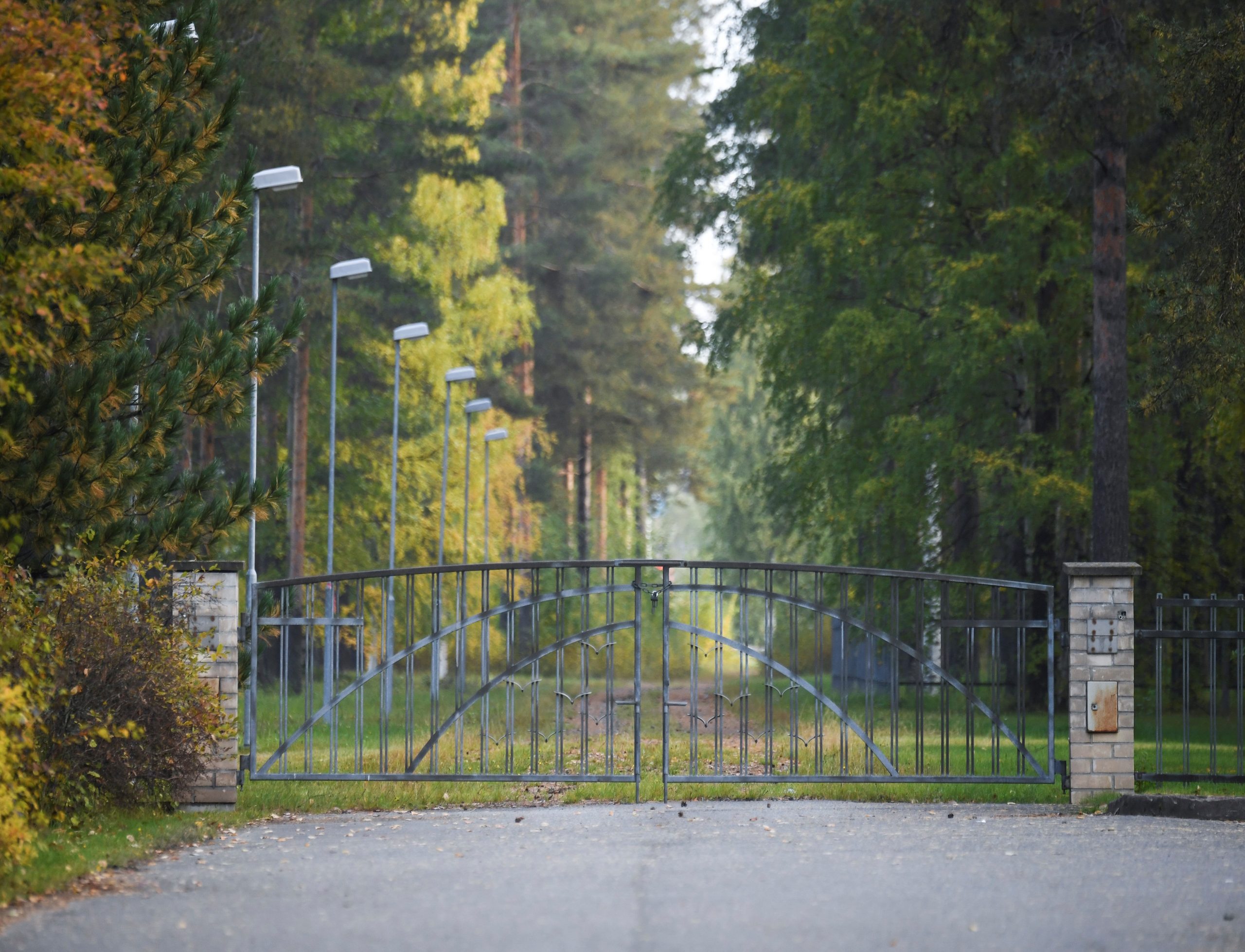 a closed cemetery gate, without visible graves