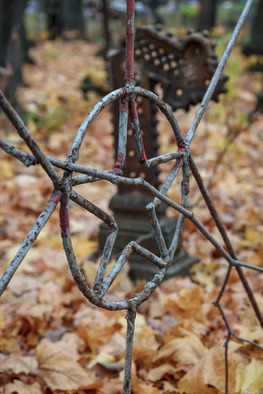 Rusty fence decoration with a Soviet star