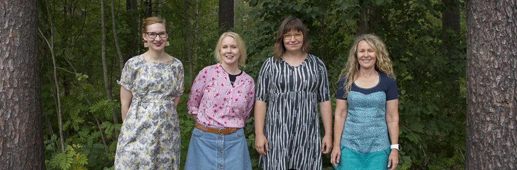 Four Finnish reseacher ladies in the forest. From left to right: Phd student Kaisa Vainio, Dr. Karoliina Lummaa, Dr. Aino Korrensalo and professor Eeva-Stiina Tuittila. 