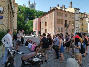 CREOLE program participants outside at the old town of Lyon, France listening to instructions for sensory walk.