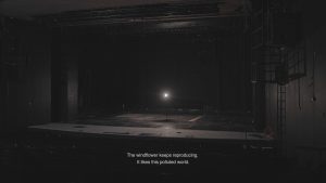 A screenshot from Ghost light artwork showing an empty theatre stage with a light.
