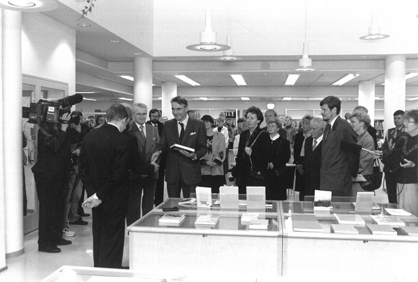 A crowd in front of the library’s display case.