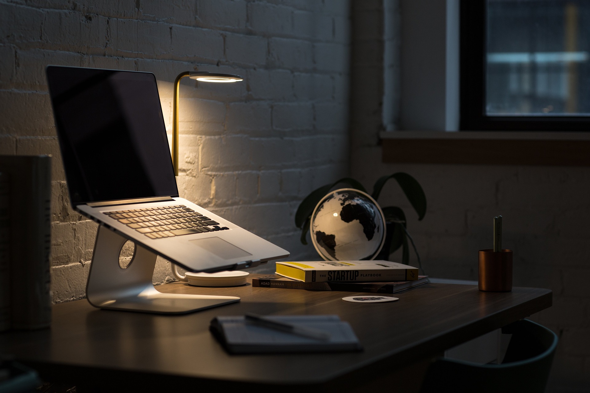 A decorative image. Laptop and other items for working on a desk.